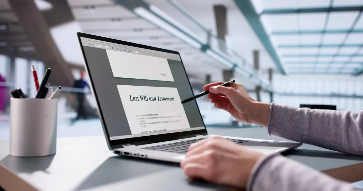 Person reviewing a last will and testament on a laptop while discussing DIY will options versus hiring an attorney.