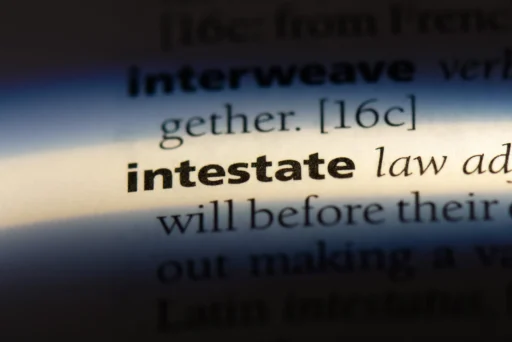 Close up of the word intestate highlighted in a dictionary for an article explaining what happens when you die without a will