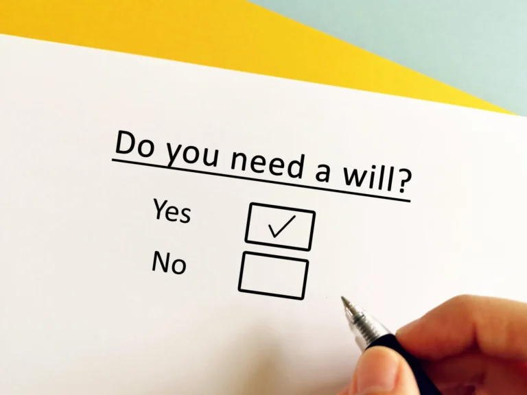 Person checking a form that asks if they need a will with the Yes box selected