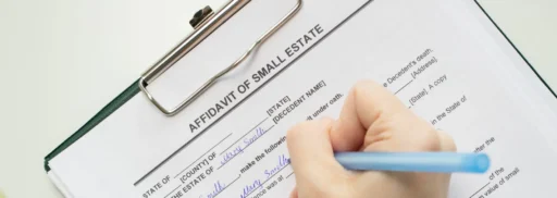 Person filling out an “Affidavit of Small Estate” form